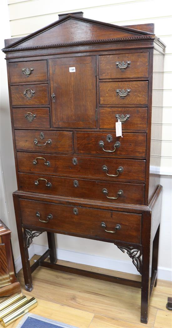 A 19th century Georgian style oak collectors cabinet and stand, H.172cm